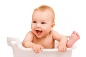 3900596 - cute baby having bath in white tub